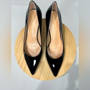 Women’s black dress shoes with low heel and silver grommet detail, Size 9